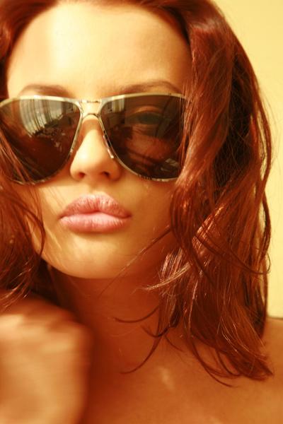 Passionate redhead putting a cigarette between her juicy lips in Met Art set Unmask
